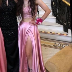 2 piece prom dress. Has padding. Tie back of the top. Adjust top to your size